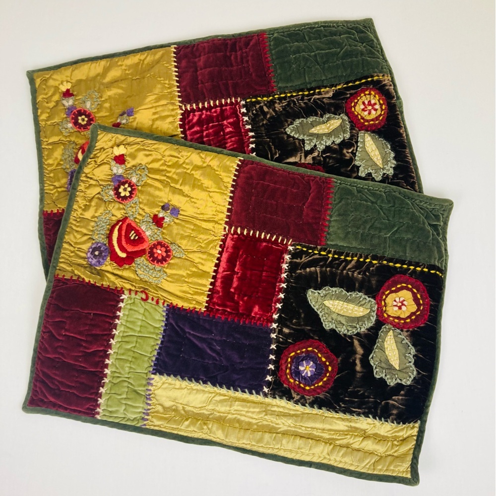 Pottery Barn colorful jewel toned patchwork pillow covers with embroidery.